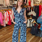 ARIELLA PRINTED SURPLICE BELTED JUMPSUIT