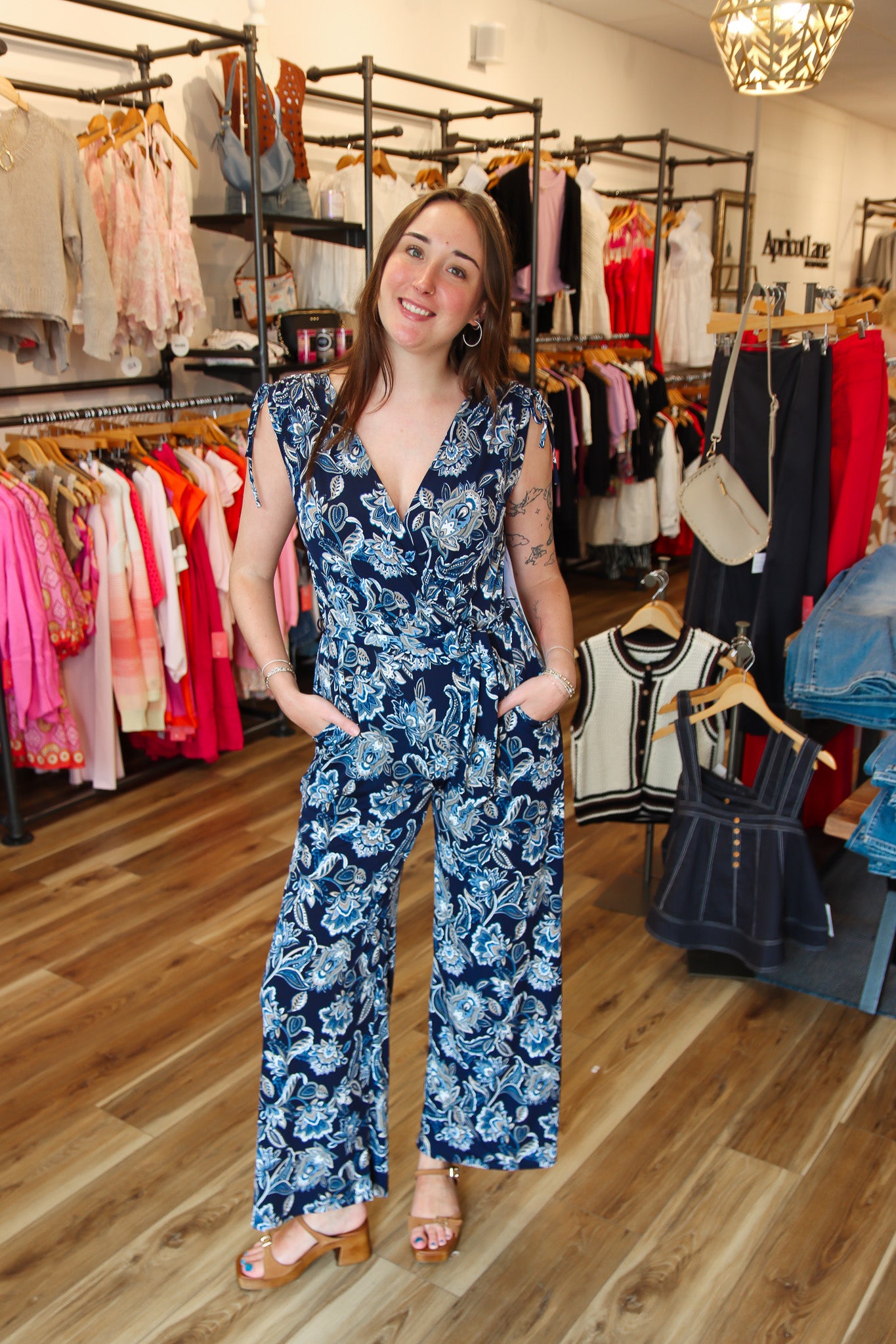 ARIELLA PRINTED SURPLICE BELTED JUMPSUIT