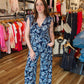 ARIELLA PRINTED SURPLICE BELTED JUMPSUIT