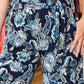 ARIELLA PRINTED SURPLICE BELTED JUMPSUIT